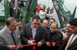 Chief Minister, Mr. Omar Abdullah launching two latest amphibian multi-functional dredgers for cleaning operation in the Dal lake, Kashmir.