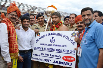 Wrestler Satyavart holding 9th Roustam-E-International Indian Style Wrestling Title